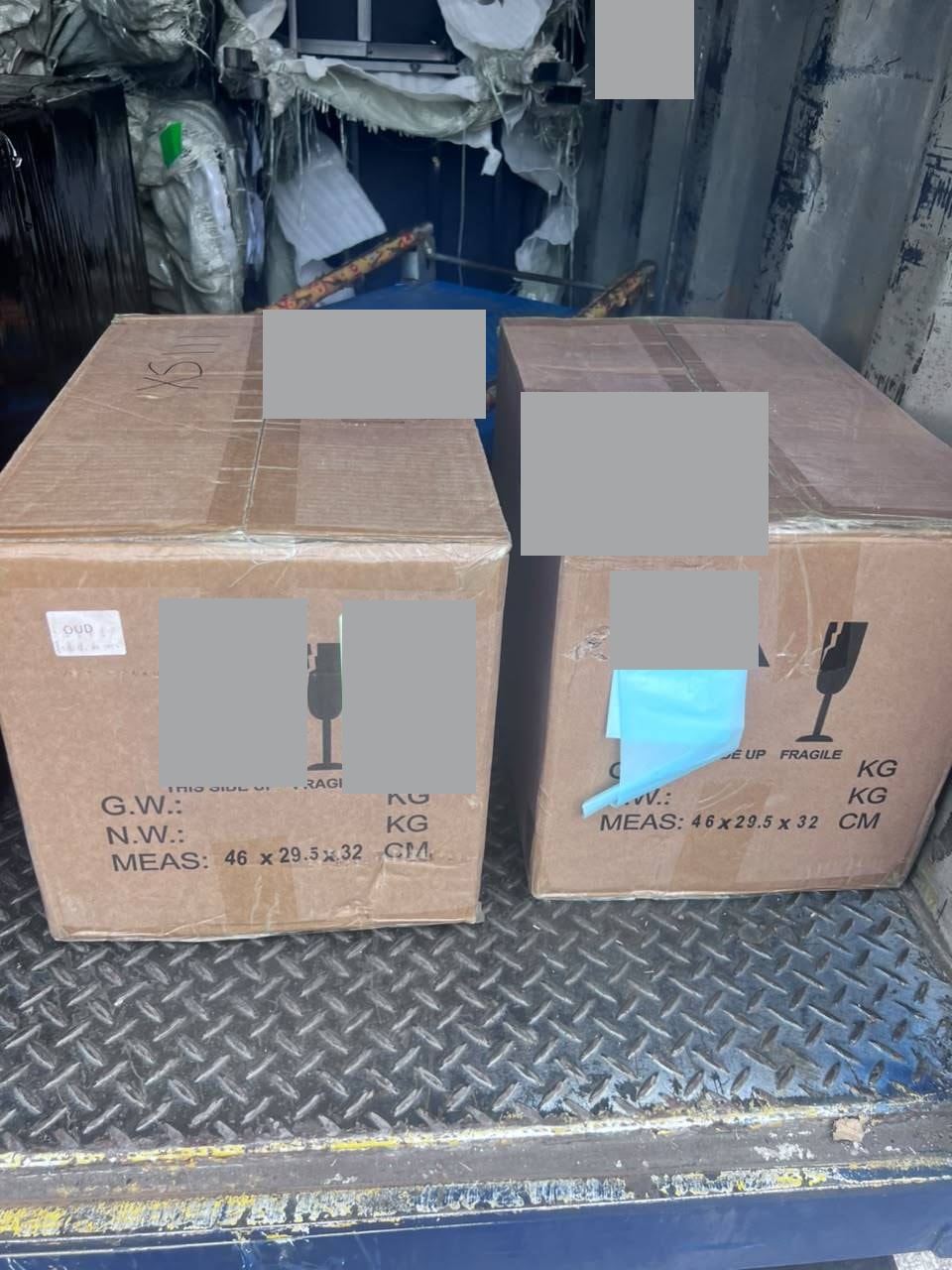 Two cartons from the Muar fragrance shipment at pickup